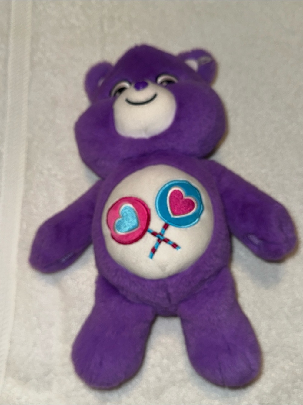 Care Bears Purple Plush with Pink & Blue Heart Lollipop Belly Badge